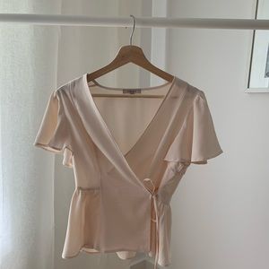 Deep V, Peplum blouse with flutter sleeve